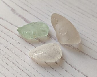 Three pieces of patterned Scottish sea glass