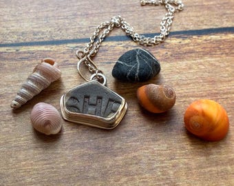 sea pottery silver pendant necklace featuring the word she