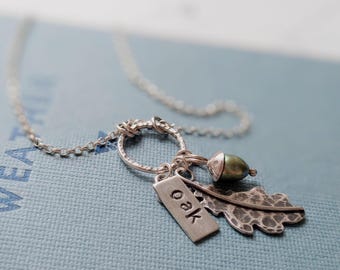 acorn and oak leaf charm necklace, silver and green freshwater pearl pendant