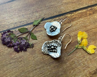 silver poppy flower drop earrings