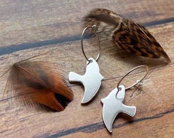 silver flying bird drop earrings