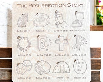 May include: A wooden board with a white background and black text and illustrations. The board is divided into 12 sections, each with a different illustration and a Bible verse. The illustrations depict scenes from the Easter story, such as the Last Supper, the crucifixion, and the resurrection. The text includes the title "The Resurrection Story" and the Bible verses from the book of Matthew.