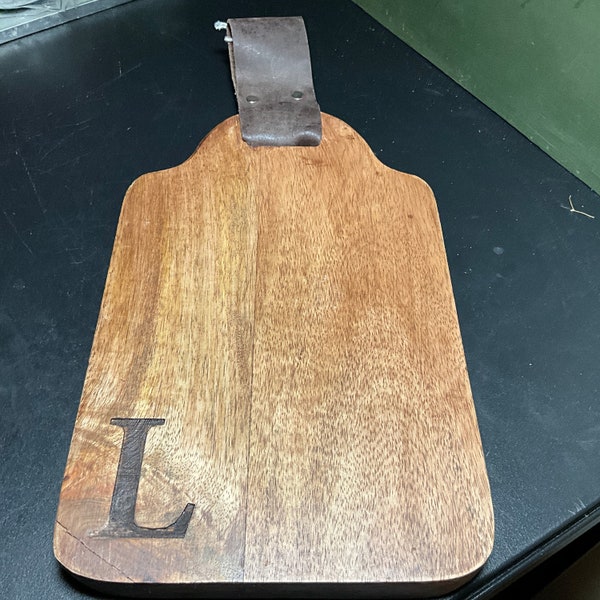 Wooden Cutting Board with large carved in L and leather hanging strap kitchen collectible wall hanging