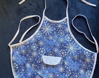 Child's apron blue with snowflakes