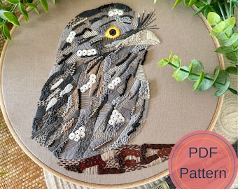 May include: Embroidered owl with brown, gray, and white thread on a beige fabric background. The owl is surrounded by a wooden embroidery hoop. The text "PDF Pattern" is in a red circle in the lower right corner of the image.