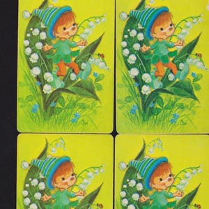May include: Four vintage playing cards featuring a cartoon elf in a green outfit and hat, surrounded by lily of the valley flowers. The background is a bright yellow, with a ladybug on one of the leaves.