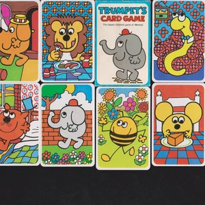 May include: A collection of ten colorful playing cards from Trumpet's Card Game, featuring cartoon illustrations of animals including a lion, elephant, snake, owl, bee, and mouse, with bold outlines and vibrant patterns on a white background.