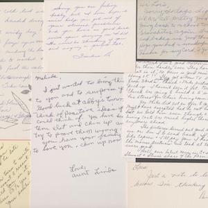 May include: A collection of handwritten letters and notes on various sizes of paper. The handwriting is in blue ink. Some notes have decorative elements like a feather drawing. The overall theme is personal correspondence.