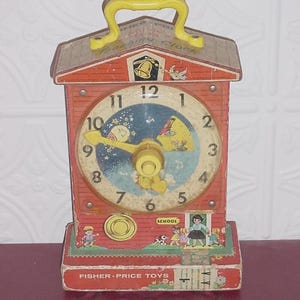 Vintage Fisher Price Toy Windup MUSIC Box TEACHING CLOCK Red Schoolhouse w Teacher & Students