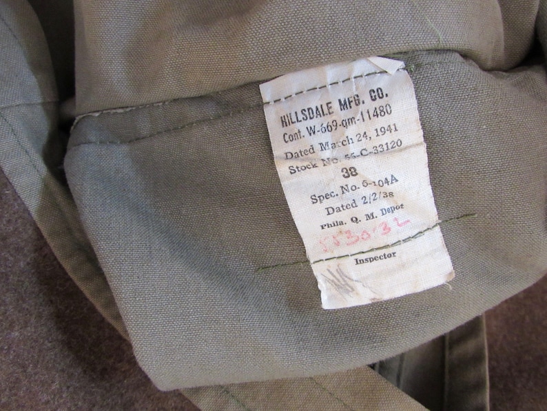 May include: A white tag with black text that reads "HILLSDALE MFG. CO. Cont. W-669-gm-11480 Dated March 24, 1941 Stock No. 56-C-33120 38 Spec. No. 6-104A Dated 2/2/38 Phila. Q. M. Depot 5530-3L Inspector"