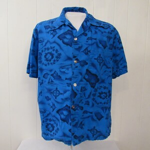May include: A blue short-sleeved button-down shirt with a tropical print featuring islands, fish, and flowers.
