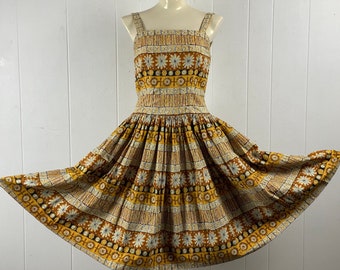 May include: A vintage yellow and brown floral print sundress with a fitted bodice and a full skirt. The dress has a square neckline and thin straps.