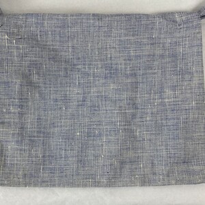 May include: A small blue and white checkered fabric bag with a strap.