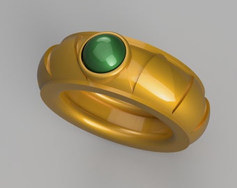 May include: A gold ring with a green gemstone set in the centre. The ring has a textured band with a raised design.