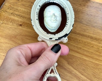 Curio mini hand mirror with clay face (ref 124)