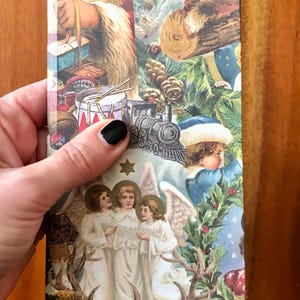 May include: A vintage Christmas card with a collage of images including Santa Claus, angels, a train, and a drum. The card has a blue, green, and gold color scheme.