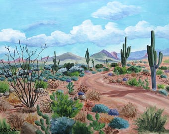 May include: An acrylic painting of a desert landscape featuring a winding dirt road, cacti, and various desert plants. The sky is a light blue with fluffy white clouds, and mountains are visible in the background. The artwork is signed in the lower left corner.