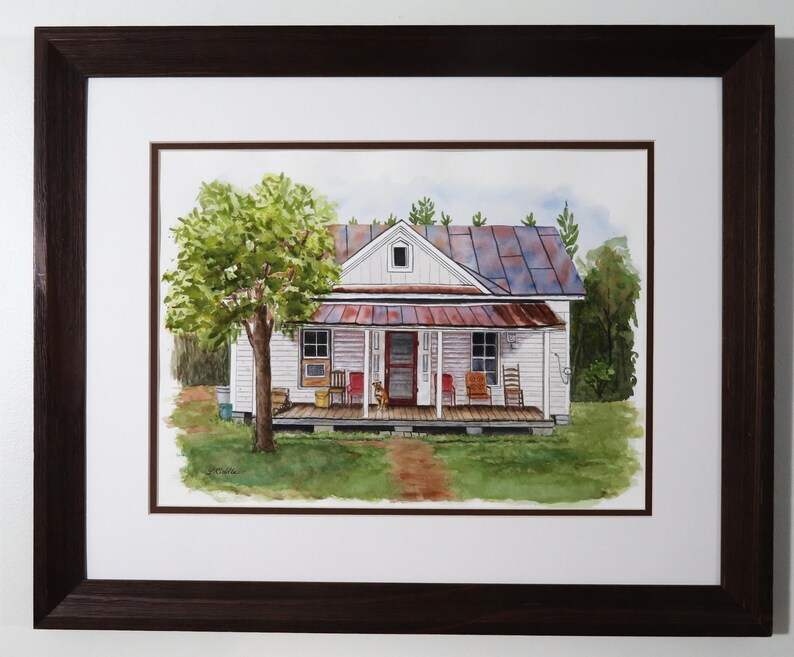 May include: A watercolor painting of a white farmhouse with a rusty metal roof. The house has a front porch with rocking chairs and a large tree in the front yard.