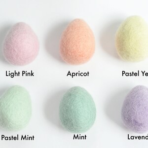 May include: Six felt balls in various pastel colors: light pink, apricot, pastel yellow, pastel mint, mint, and lavender.