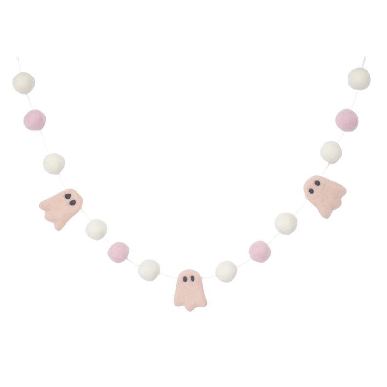 May include: A pink and white felt garland with pink ghost cutouts. The garland is strung with white and pink pom poms.