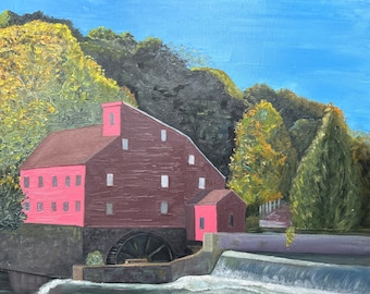 May include: A painting of a red mill with a water wheel, surrounded by trees. The mill is set against a blue sky with white clouds.
