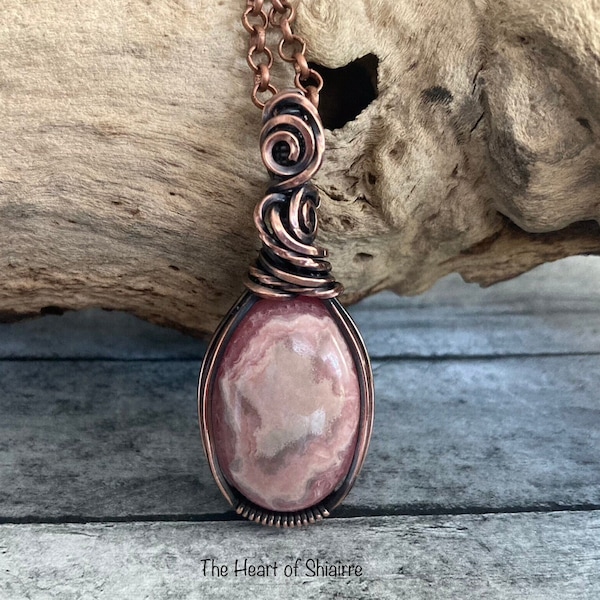 Rhodochrosite wire wrapped pendant. Copper. Love. Compassion. Self forgiveness. Personal growth. Handcrafted artisan jewelry. Gift idea.