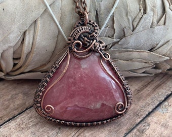 Rhodochrosite wire wrapped pendant. Copper. Love and compassion. Self forgiveness. Self love. Handcrafted artisan jewelry. Gift idea.