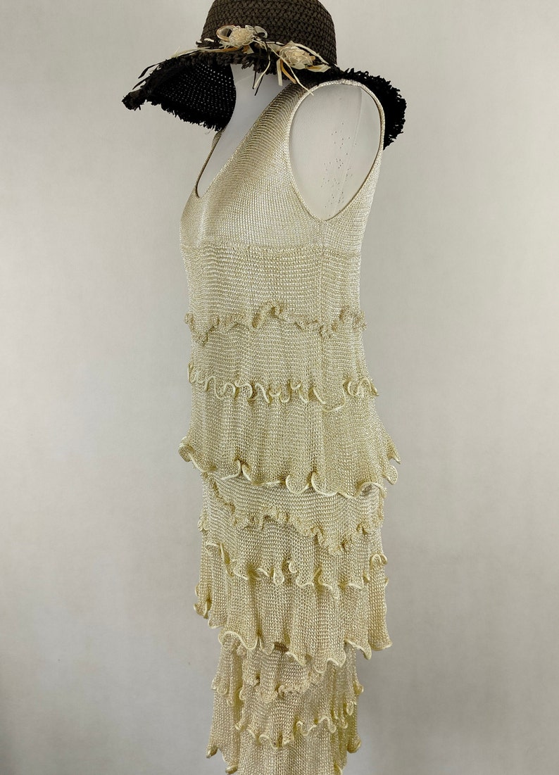 A unique dress made of viscose silk and gold metalized thread. A golden dress with ruffles. Knitted dress. Midi dress image 10