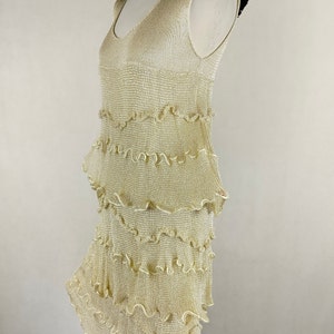 A unique dress made of viscose silk and gold metalized thread. A golden dress with ruffles. Knitted dress. Midi dress image 9