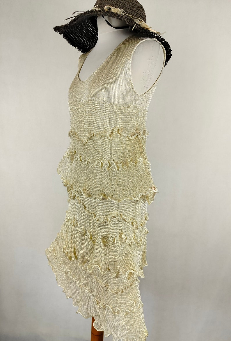 A unique dress made of viscose silk and gold metalized thread. A golden dress with ruffles. Knitted dress. Midi dress image 9