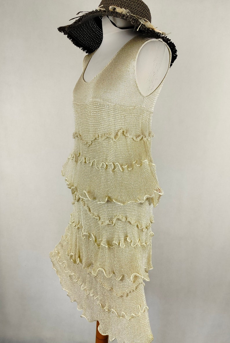 A unique dress made of viscose silk and gold metalized thread. A golden dress with ruffles. Knitted dress. Midi dress image 1
