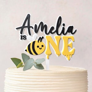 Custom name bee 1st birthday cake topper for girl with floral and honeybee details, perfect for sweet as can bee party theme