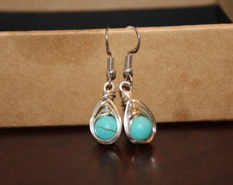 Turqoise dangly feather earrings