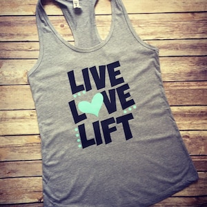 May include: Gray tank top with the text "LIVE LOVE LIFT" in black with a teal heart.