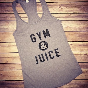 May include: Gray tank top with the text "GYM & JUICE" printed in black.