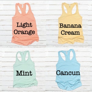 May include: Eight different colors of racerback tank tops. The colors are Heather Gray, Light Orange, Banana Cream, Royal, Tahiti Blue, Mint, Cancun, and Lilac.