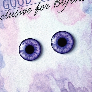 May include: Two purple and black doll eyes with a white iris and a black pupil.