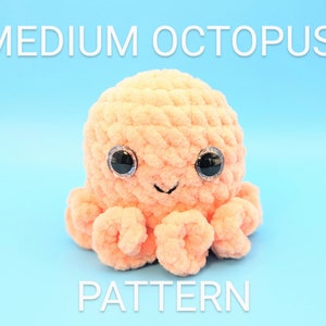 May include: A crocheted plush octopus toy in a peach colour with black eyes and a smiling mouth. The toy is sitting on a light blue background. The text "MEDIUM OCTOPUS PATTERN" is above the toy.
