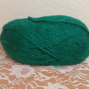 May include: A ball of emerald green yarn.