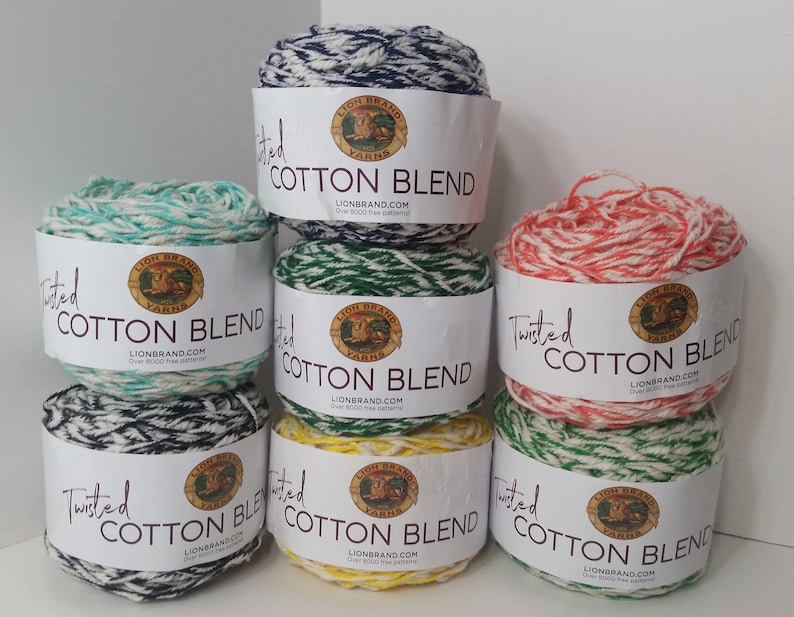 May include: Six skeins of Lion Brand Twisted Cotton Blend yarn in various color combinations. The colors include navy blue and white, green and white, red and white, yellow and white, and black and white.