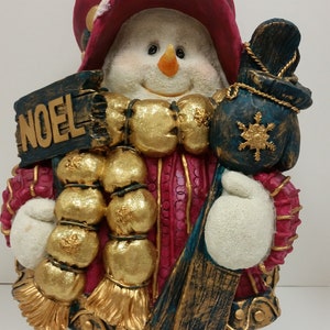 Vintage Figurine Featuring a Snowlady Holding Skiis, Mittens, and a Noel Sign (15 inches tall x 10inches wide), NO return/Exchange