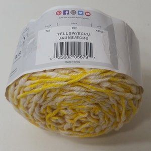 May include: A ball of yellow and ecru yarn with a label that reads "YELLOW/ECRU JAUNE/&Eacute;CRU" and has the barcode 23032 05679. The label also states "Made in China".