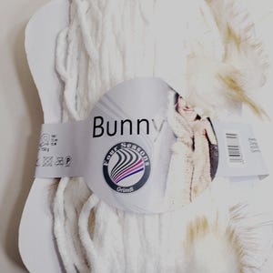 1 Skein Grundl Four Seasons Bunny Yarn, Color 15 (Off white with Off white/honey brown pom poms) 150g, 90m/approx98y, Machine Wash/Lay Flat