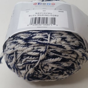 May include: A ball of navy blue and ecru yarn. The label reads "NAVY/ECRU BLEU MARINE/&Eacute;CRU" and has a barcode. The label also says "Made in China".