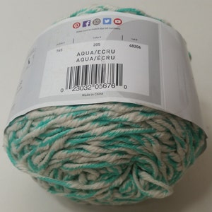 May include: A ball of aqua and ecru yarn with a white label that says "Aqua/Ecru" and has a barcode. The label also says "Color # 205" and "Lot # 48206". Made in China.