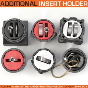 May include: Six different ring holders for a ring box. The holders are made of gray plastic and have a variety of colors and designs.  The holders are designed to hold rings, a necklace, and other jewelry.  "ADD AN EXTRA INTERCHANGEABLE RING HOLDER TO YOUR RING BOX"