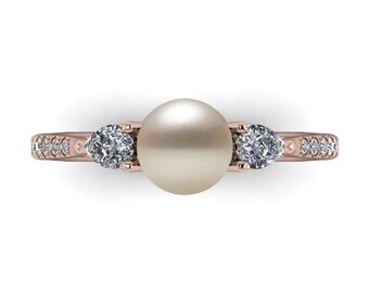 PEARS & PEARLS: Pearl solitaire accented by pear diamonds