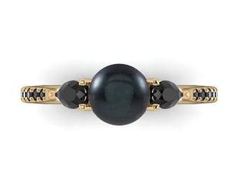 PEARS & PEARLS: Black Pearl solitaire accented by pear Black Diamonds