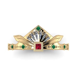 May include: A gold ring with a geometric design featuring a red square gemstone surrounded by smaller green square gemstones and a fan of clear baguette-shaped gemstones.