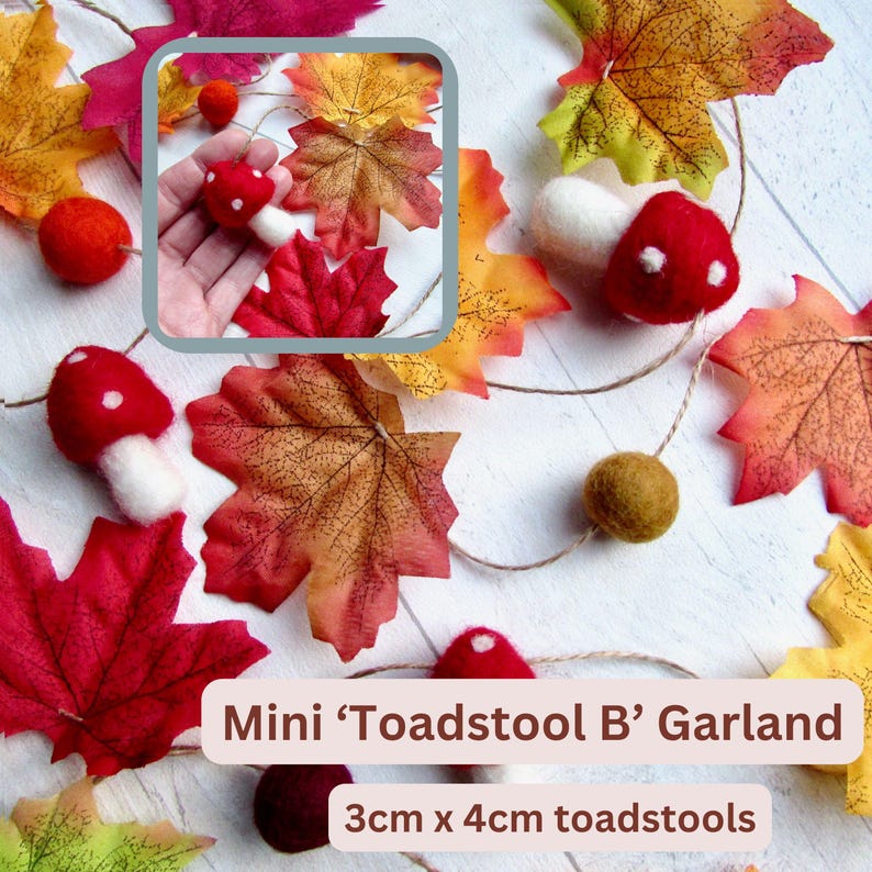 May include: A garland featuring felted red and white toadstools measuring 3cm by 4cm, interspersed with artificial autumn maple leaves in shades of red, orange, and yellow, and small felt balls on a string, labeled Mini Toadstool B Garland.